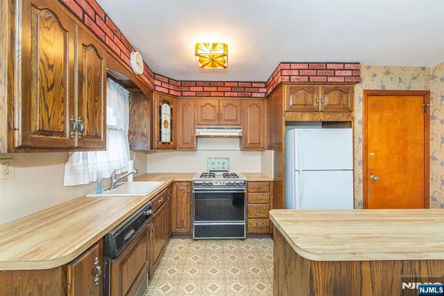 a kitchen with a stove and a sink