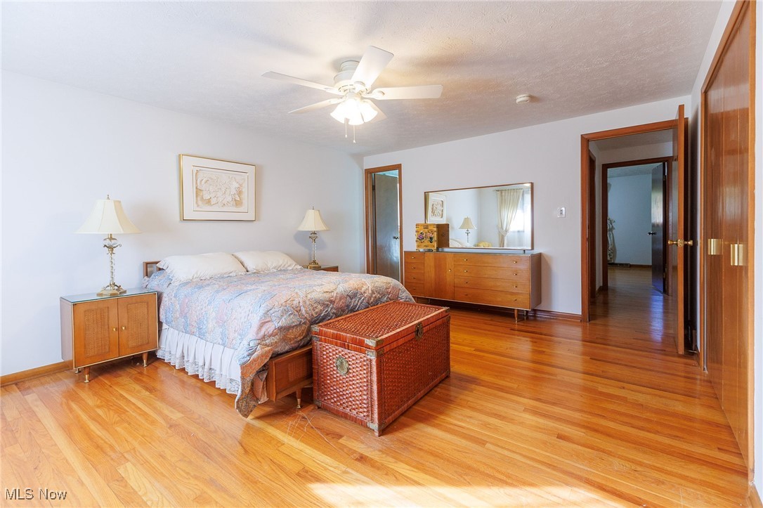 966 Brainard Road Cleveland, OH 44143 - Photo 28 of 50 Bedroom with light hardwood / wood-style floors, a textured ceiling, and ceiling fan
