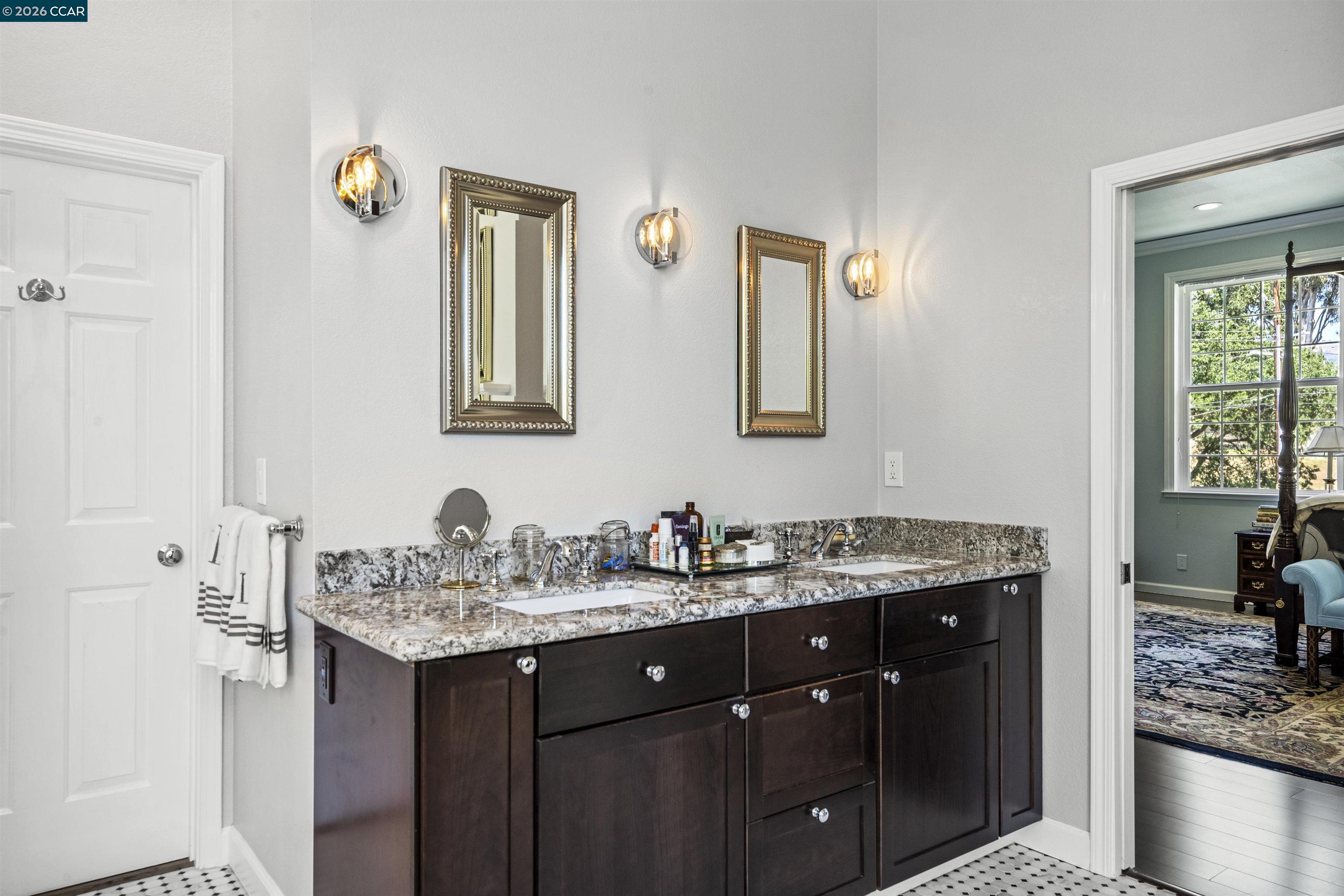 177 Oak Road Alamo, CA 94507 - Photo 33 of 85 a bathroom with a granite countertop sink and a mirror
