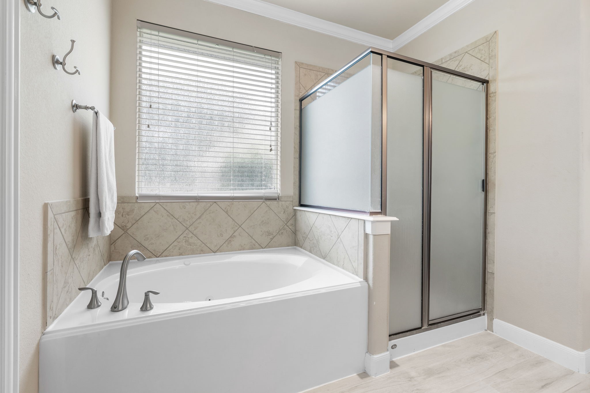 11 Pintuck Place Spring, TX 77389 - Photo 22 of 40 a bathroom with a bathtub and a shower