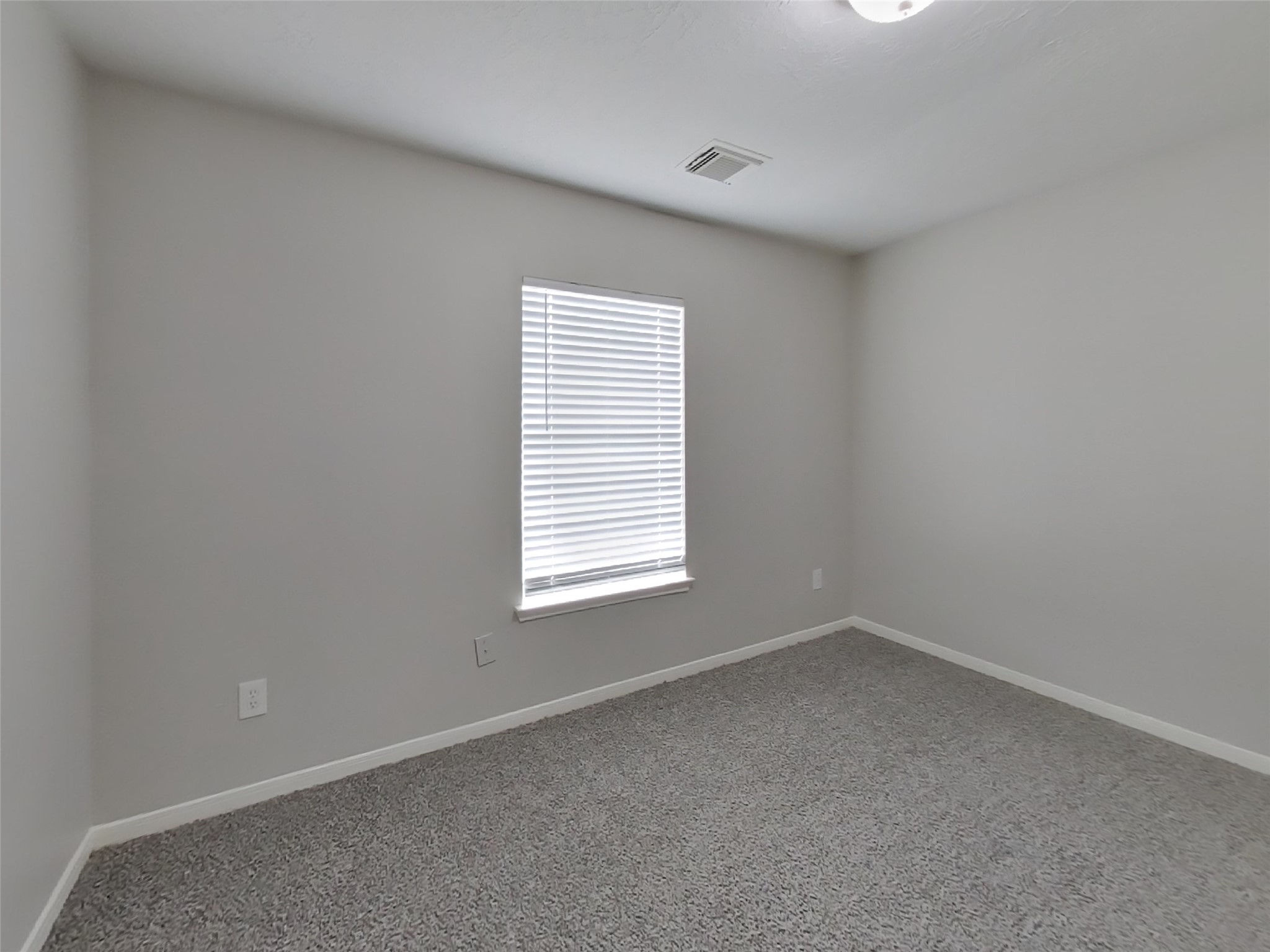 21526 Lovis Way Humble, TX 77338 - Photo 12 of 17 an empty room with a window