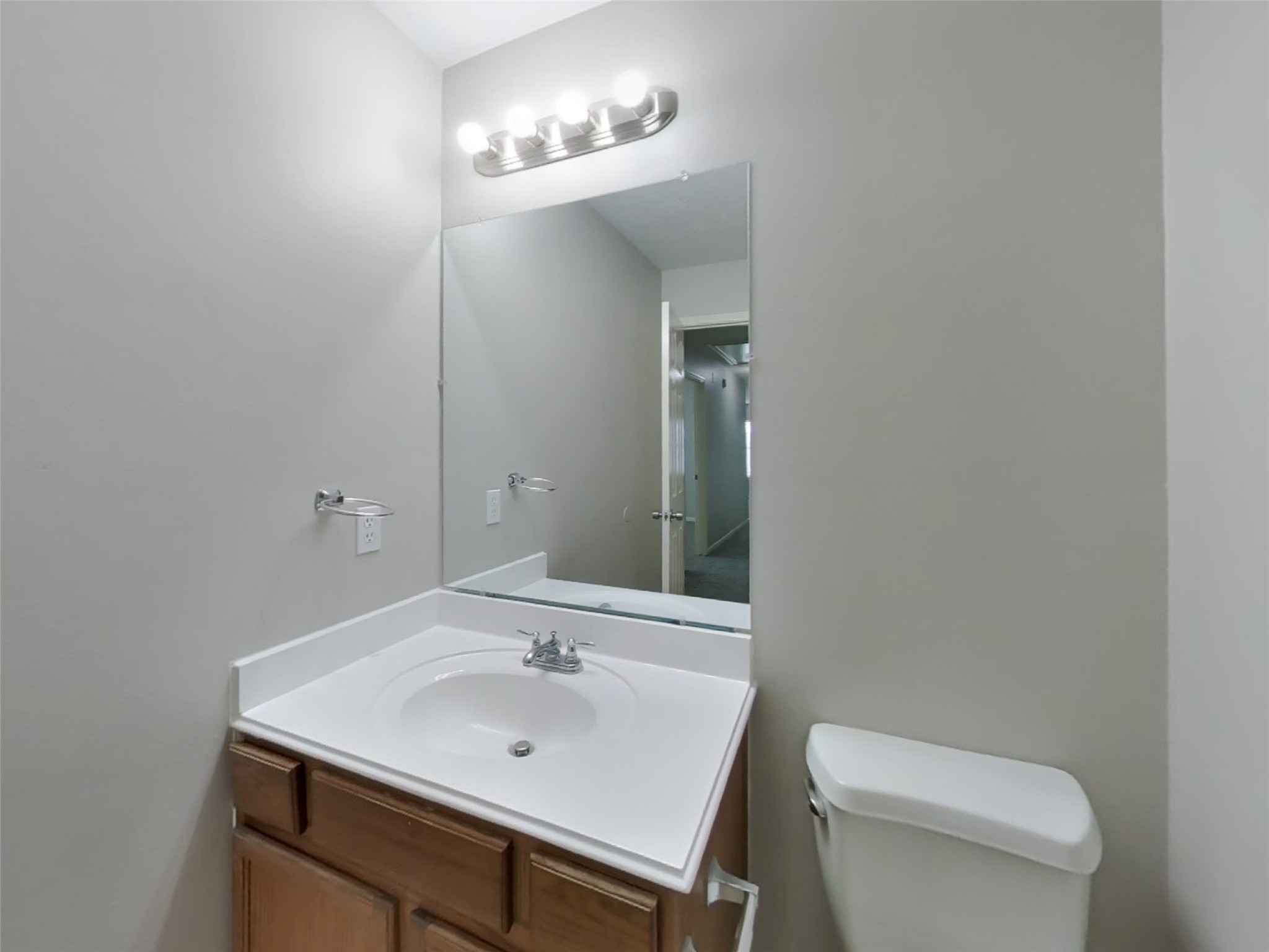 21526 Lovis Way Humble, TX 77338 - Photo 13 of 17 a bathroom with a toilet a sink and mirror
