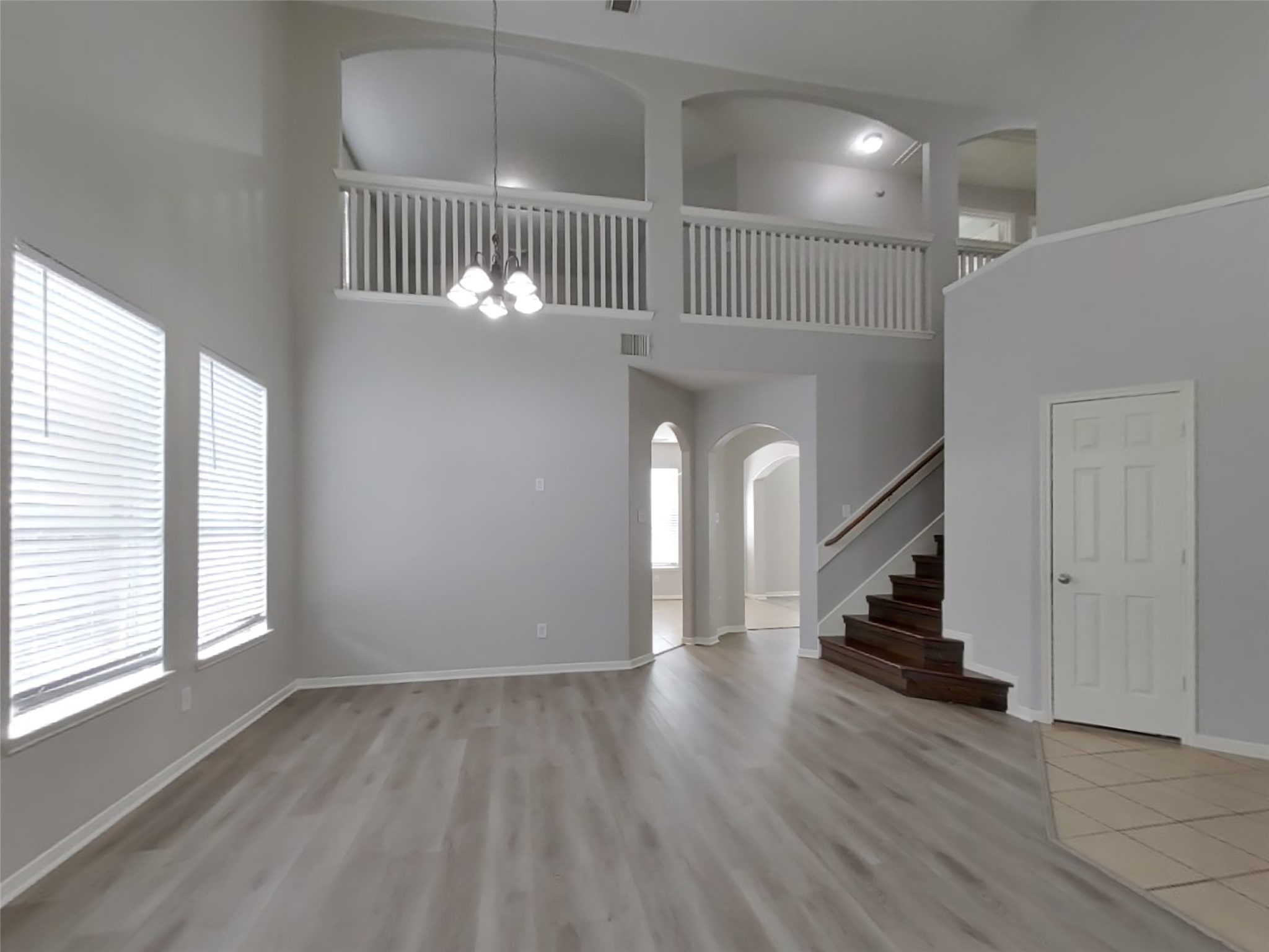 21526 Lovis Way Humble, TX 77338 - Photo 4 of 17 wooden floor in an empty room with a window