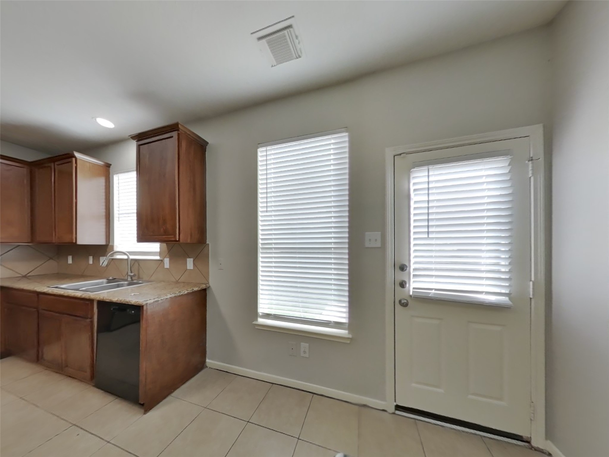 21526 Lovis Way Humble, TX 77338 - Photo 5 of 17 a kitchen with a stove and a sink