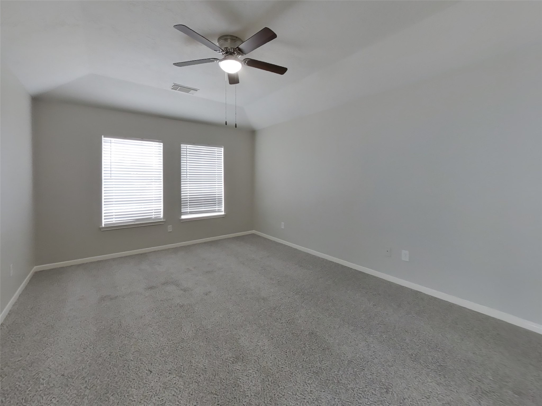 21526 Lovis Way Humble, TX 77338 - Photo 6 of 17 an empty room with windows and fan