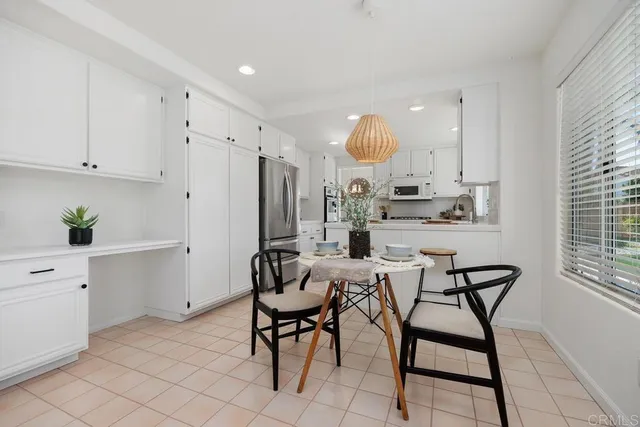 a view of kitchen with furniture and window