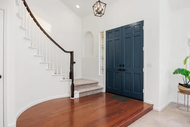 a view of entryway with wooden floor