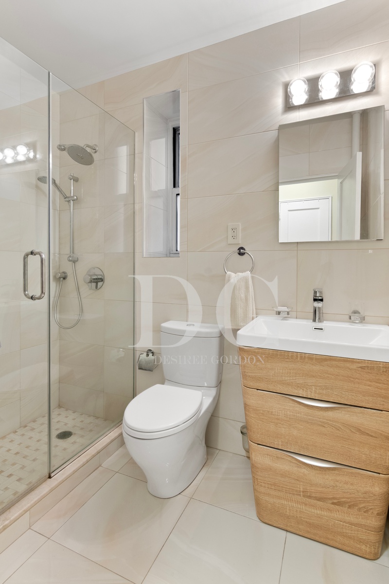 36 Dahill Road, Unit 2I Brooklyn, NY 11218 - Photo 3 of 9 a bathroom with a toilet a sink and shower