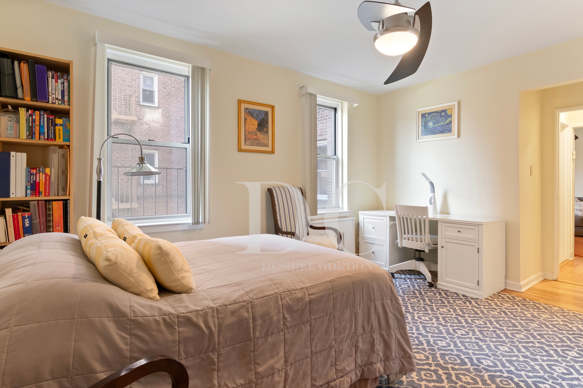 36 Dahill Road, Unit 2I Brooklyn, NY 11218 - Photo 5 of 9 a bedroom with a large bed and a book shelf