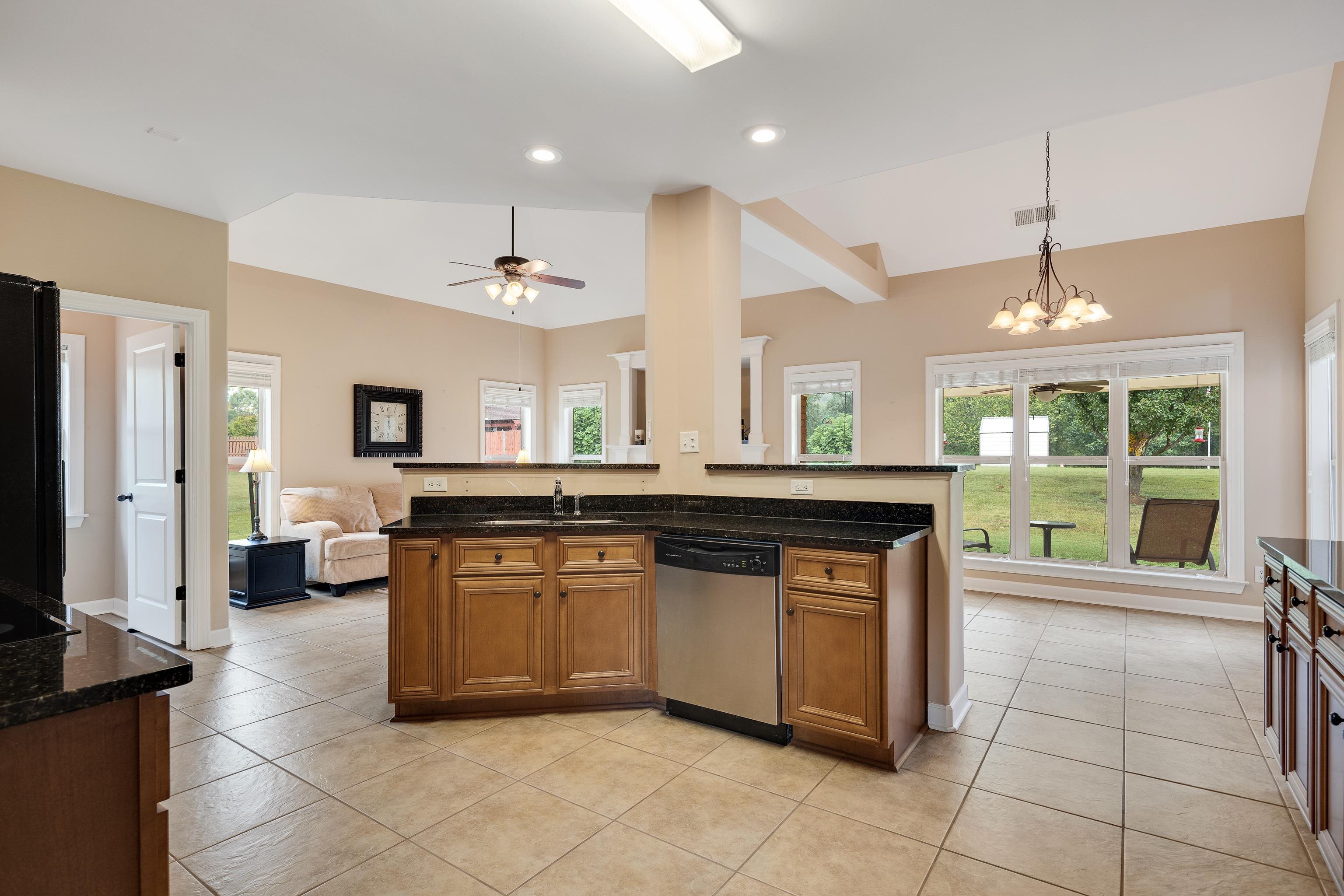 90 Rolling Meadows Road Somerville, TN 38068 - Photo 12 of 37 a kitchen with a sink stove and cabinets