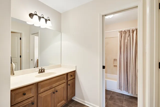 a bathroom with a toilet and a tub