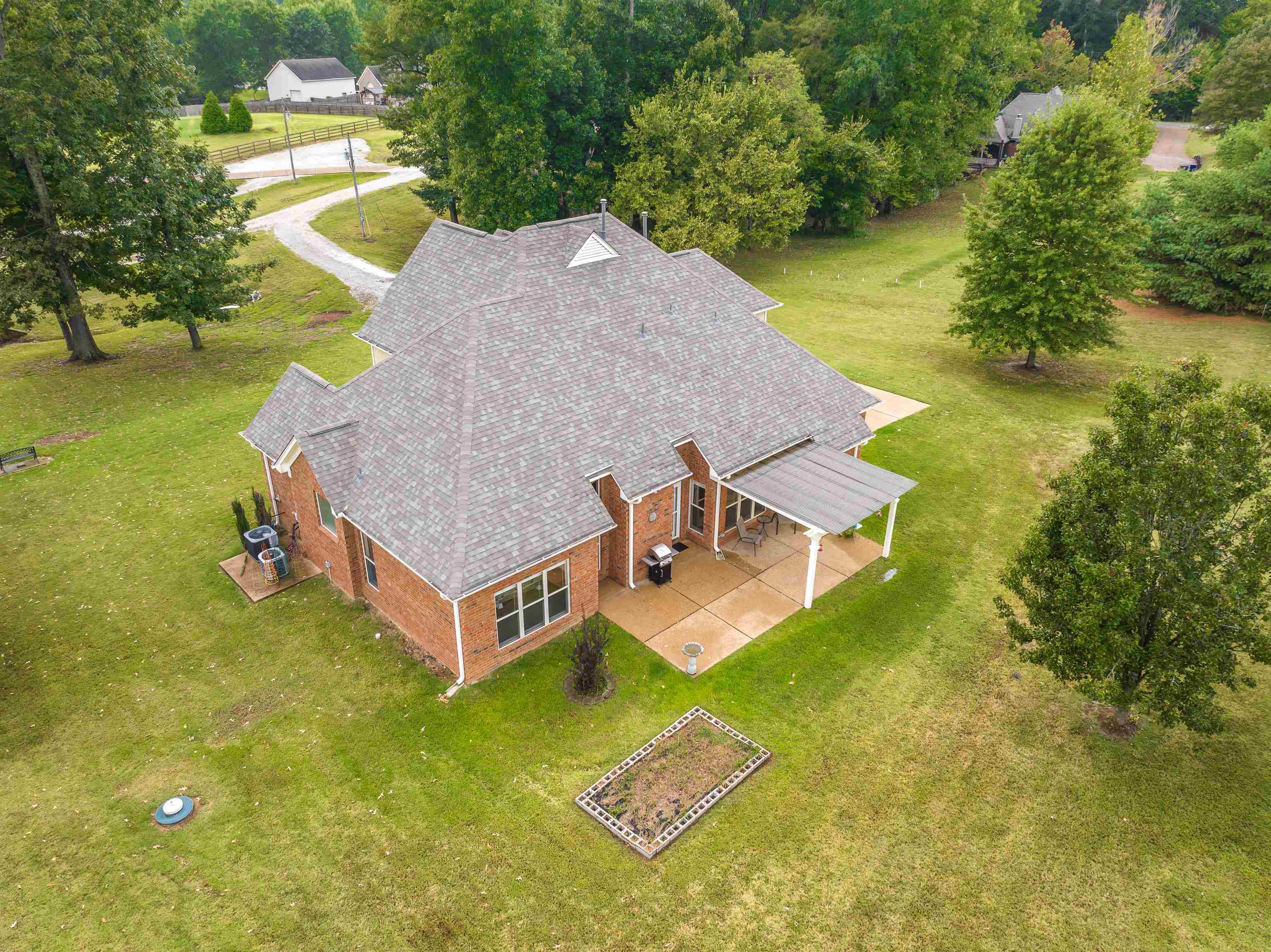 90 Rolling Meadows Road Somerville, TN 38068 - Photo 31 of 37 an aerial view of a house with swimming pool and big yard