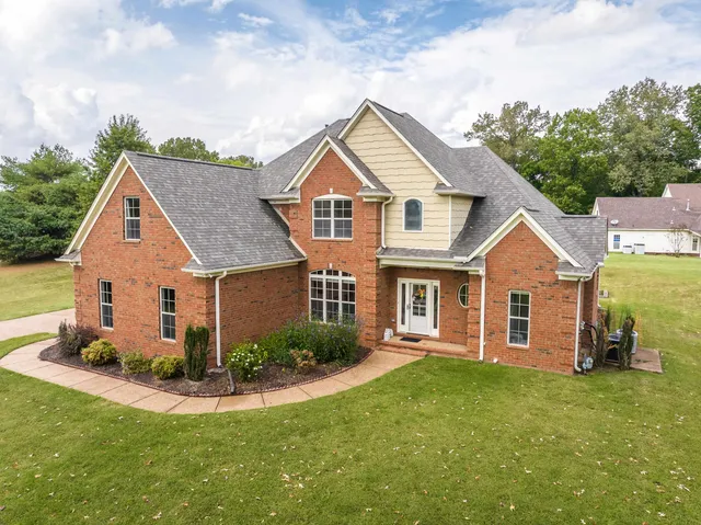 a house view with a garden space