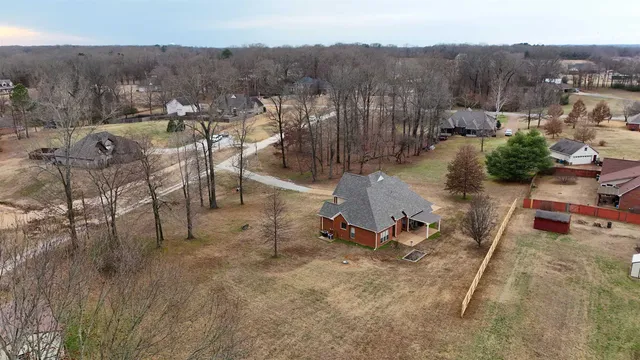a view of a swimming pool with a yard and mountain view