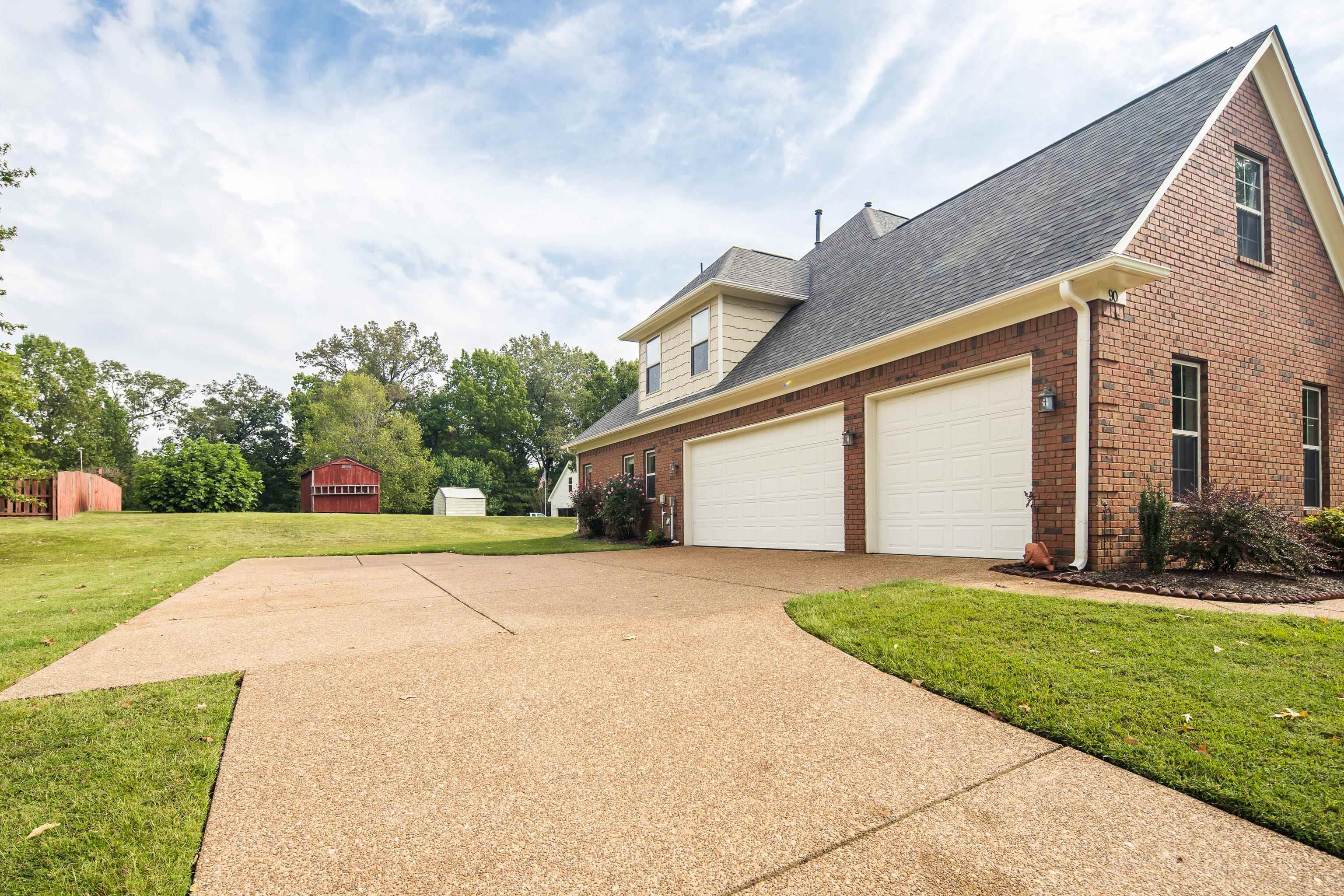90 Rolling Meadows Road Somerville, TN 38068 - Photo 5 of 37 a house view with a garden space
