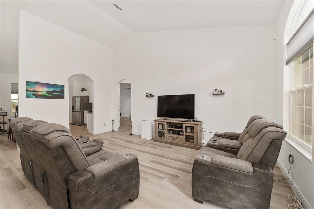 4321 Southwest 106th Place Ocala, FL 34476 - Photo 13 of 82 a living room with furniture and a flat screen tv