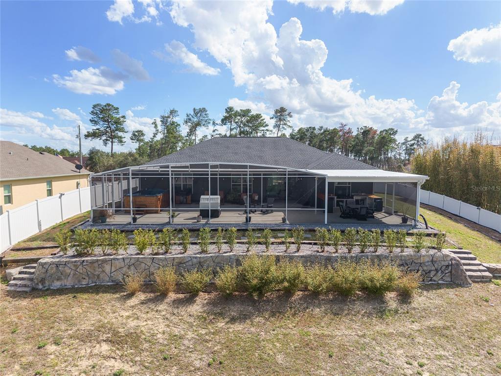 4321 Southwest 106th Place Ocala, FL 34476 - Photo 2 of 82 a view of house with swimming pool and lake view
