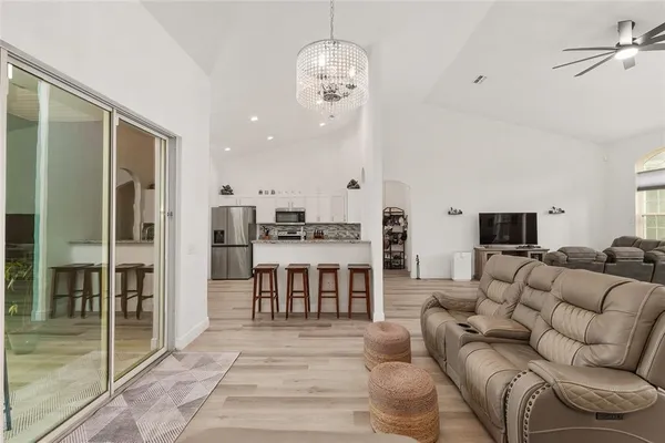 a view living room with granite countertop furniture and wooden floor