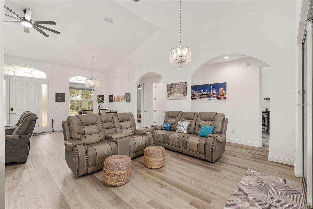 4321 Southwest 106th Place Ocala, FL 34476 - Photo 22 of 82 a living room with furniture kitchen view and a chandelier