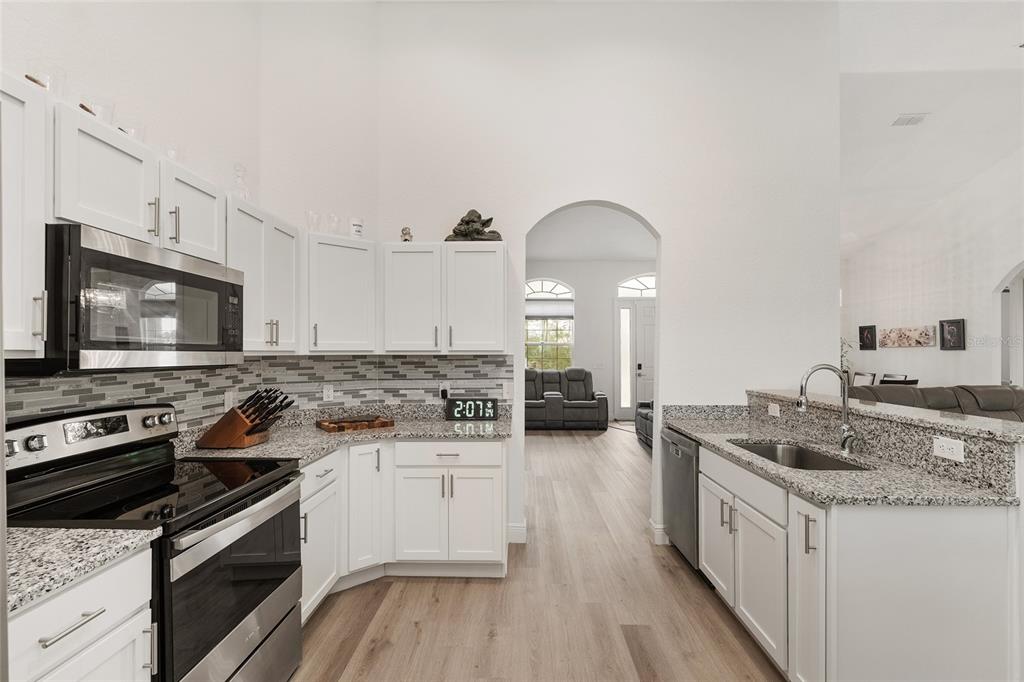 4321 Southwest 106th Place Ocala, FL 34476 - Photo 26 of 82 a kitchen with a stove and a sink