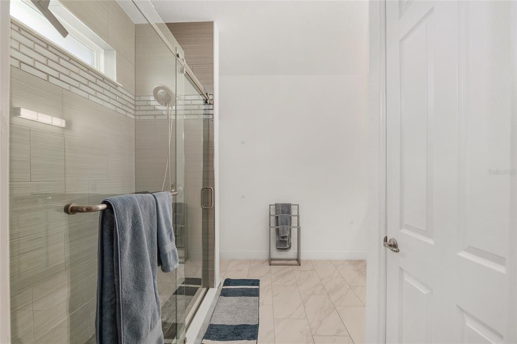 4321 Southwest 106th Place Ocala, FL 34476 - Photo 34 of 82 a bathroom with a shower and a mirror