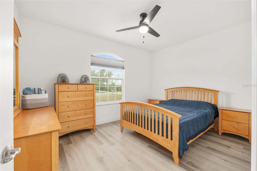 4321 Southwest 106th Place Ocala, FL 34476 - Photo 39 of 82 a bedroom with a bed and a dresser