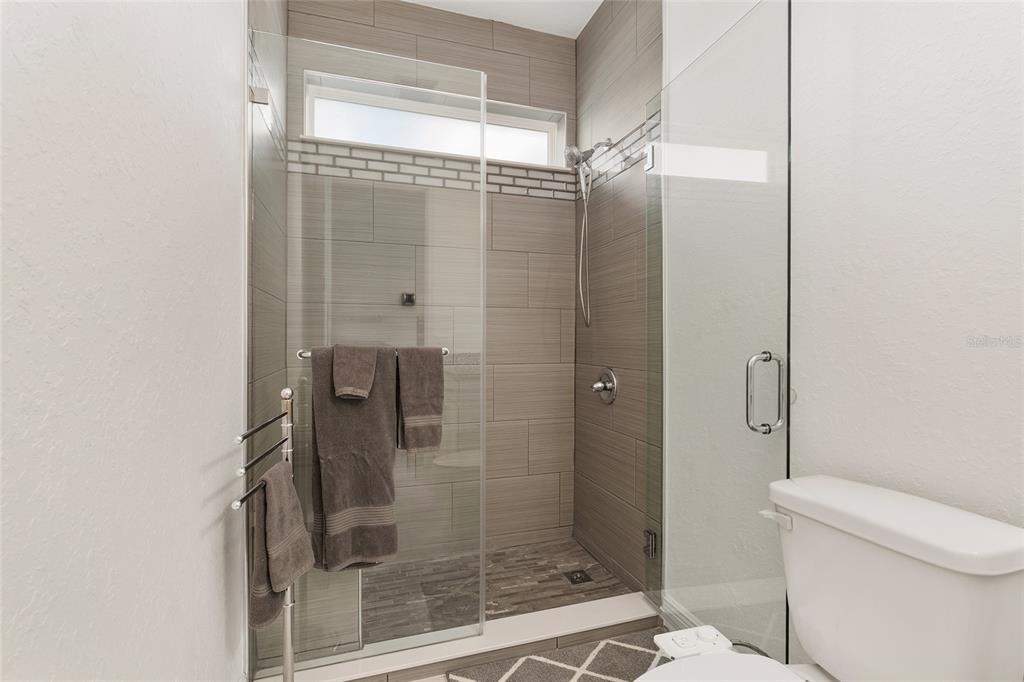 4321 Southwest 106th Place Ocala, FL 34476 - Photo 43 of 82 a bathroom with a shower and toilet