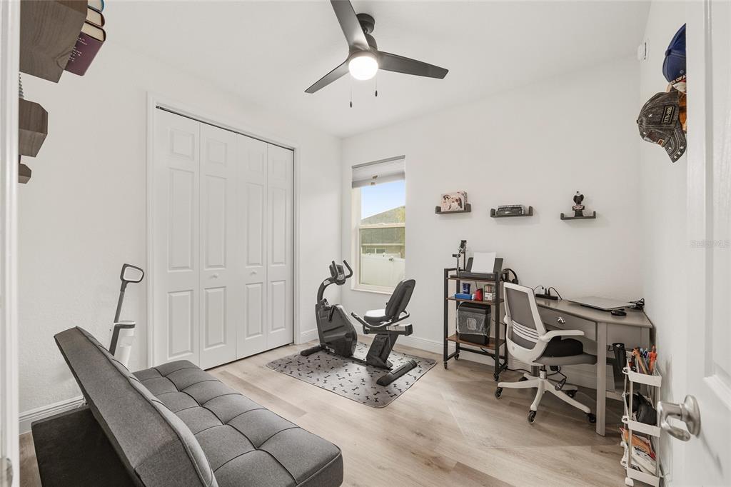4321 Southwest 106th Place Ocala, FL 34476 - Photo 46 of 82 a view of a workspace with furniture and a ceiling fan