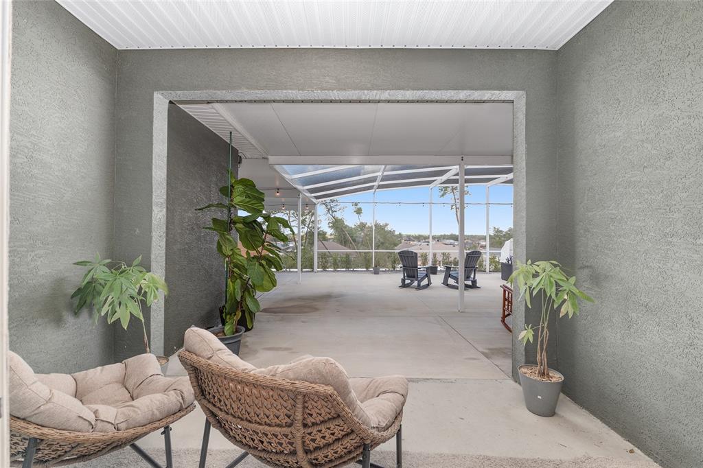 4321 Southwest 106th Place Ocala, FL 34476 - Photo 49 of 82 a lobby with furniture and a potted plant