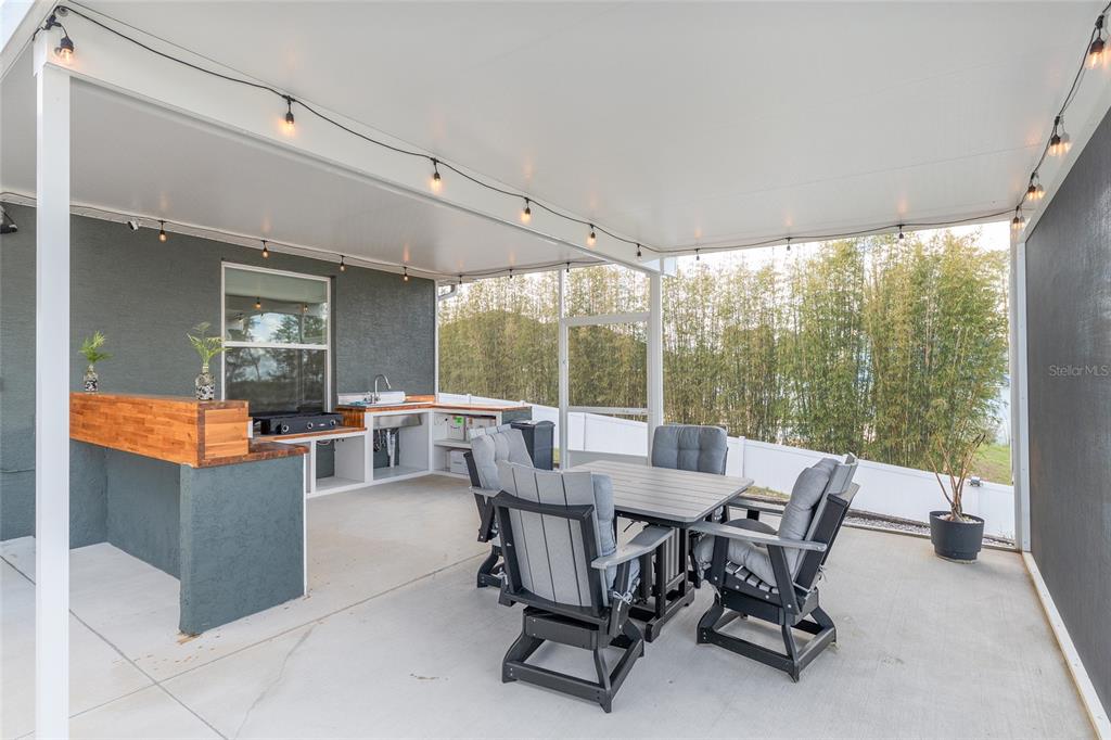 4321 Southwest 106th Place Ocala, FL 34476 - Photo 61 of 82 a dining room with furniture and a large window