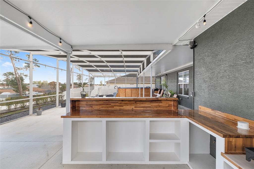 4321 Southwest 106th Place Ocala, FL 34476 - Photo 66 of 82 a view of water heater room with wooden floor