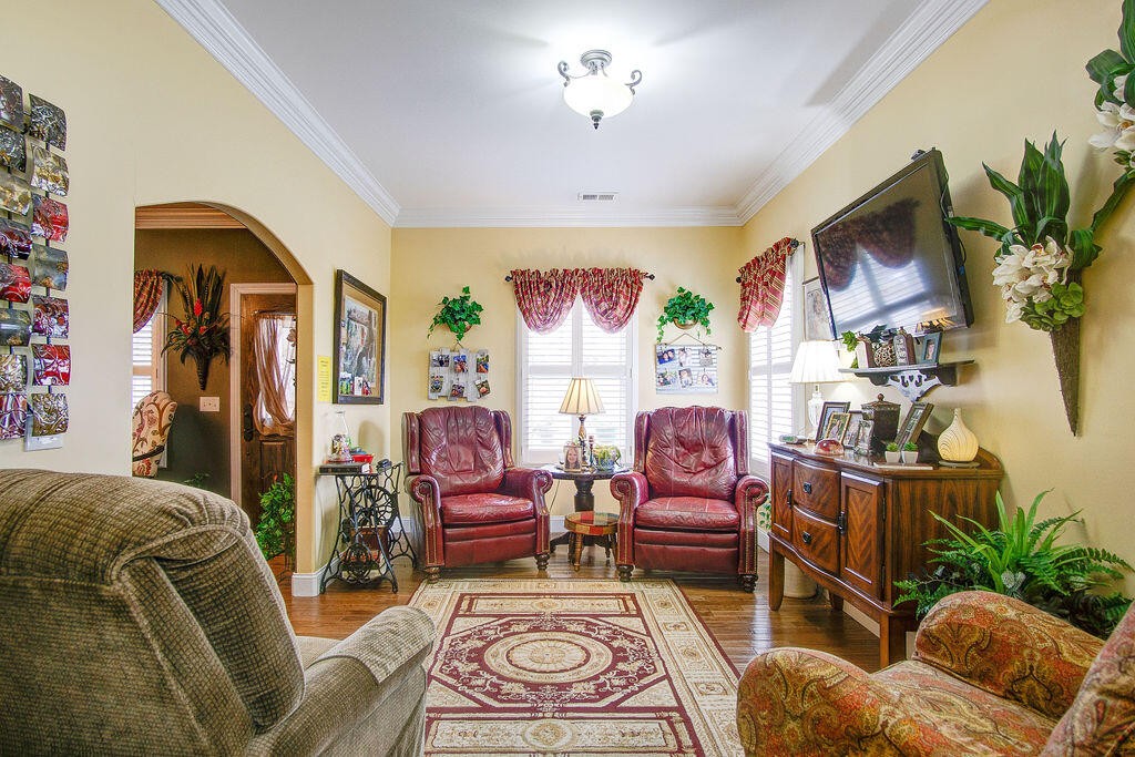 734 Bryant Road Cohutta, GA 30710 - Photo 16 of 42 a living room with furniture flower pot and a fireplace