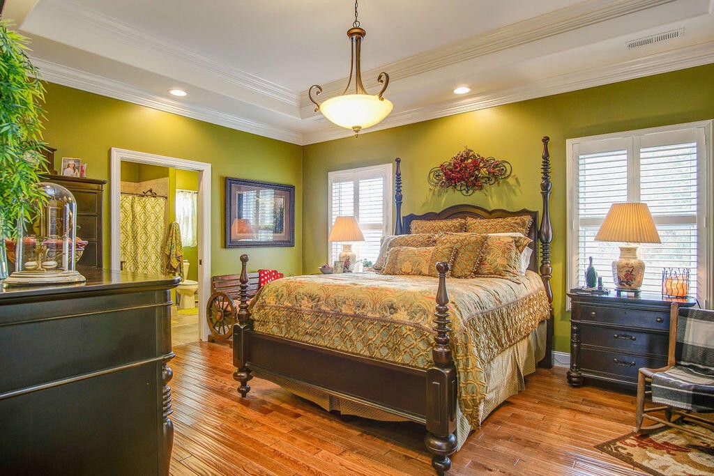 734 Bryant Road Cohutta, GA 30710 - Photo 32 of 42 a bedroom with a bed and wooden floor