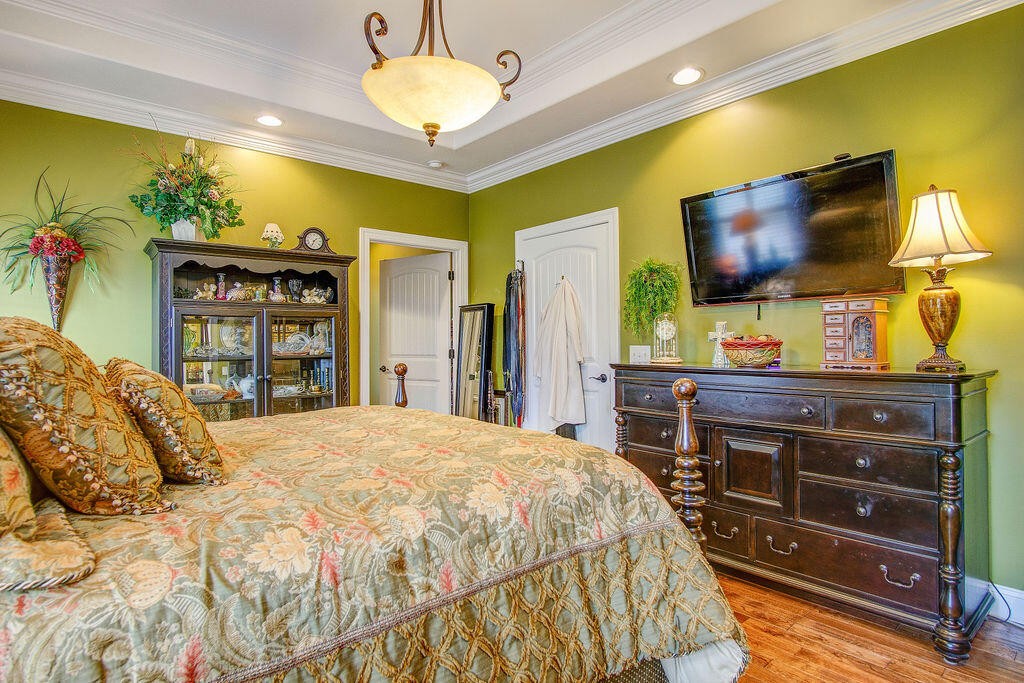 734 Bryant Road Cohutta, GA 30710 - Photo 34 of 42 a bedroom with a bed and a flat screen tv