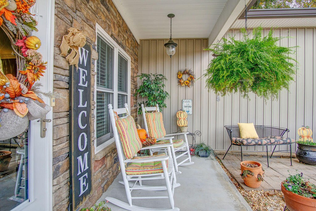734 Bryant Road Cohutta, GA 30710 - Photo 4 of 42 a view of a patio with a table and chairs and potted plants