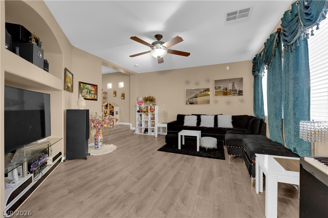 8170 West Festuca Way Las Vegas, NV 89113 - Photo 9 of 29 Living area with ceiling fan and light wood finished floors
