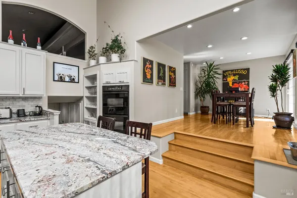 a view of kitchen with furniture and flat screen tv