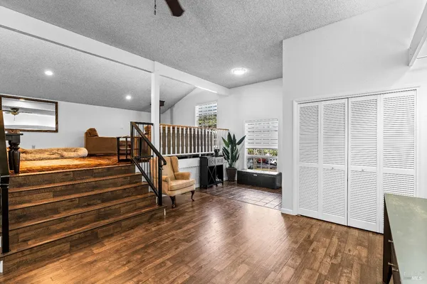a room with stairs and a wooden floor