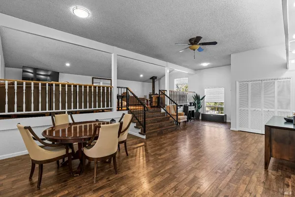 a view of a dining room with furniture and wooden floor