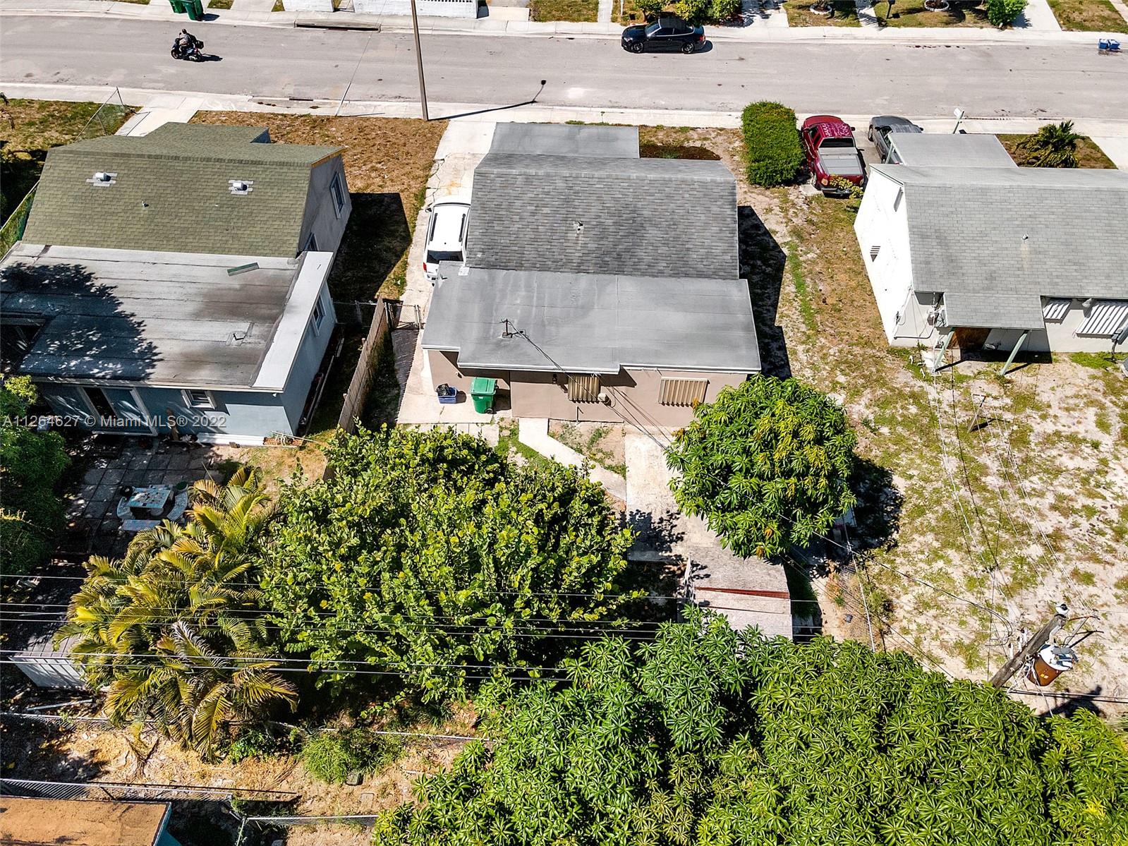633 West 3rd Street Riviera Beach, FL 33404 - Photo 44 of 52 an aerial view of residential houses with outdoor space
