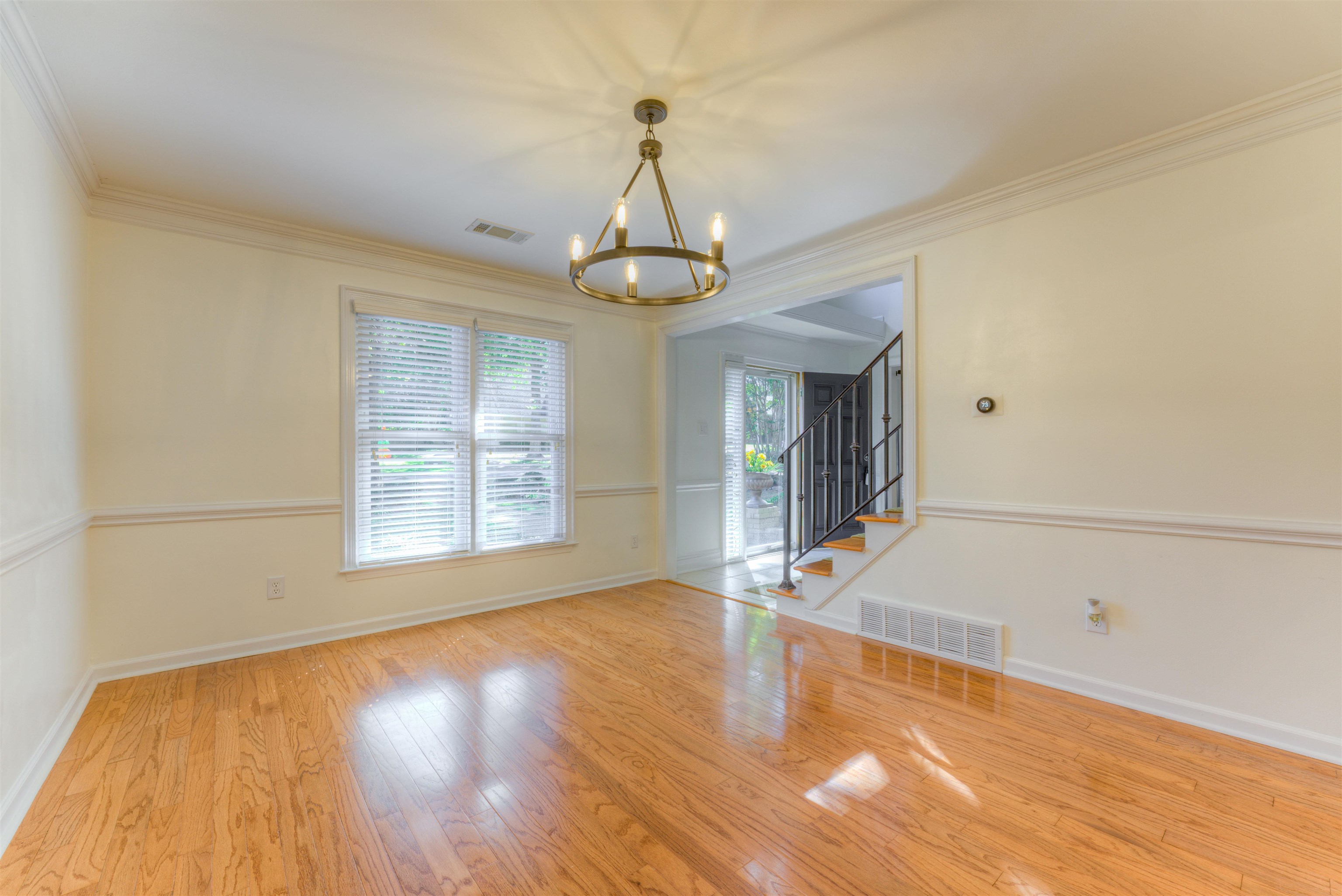 3385 Beaver Run Drive Collierville, TN 38017 - Photo 7 of 29 a view of an empty room with wooden floor and a window