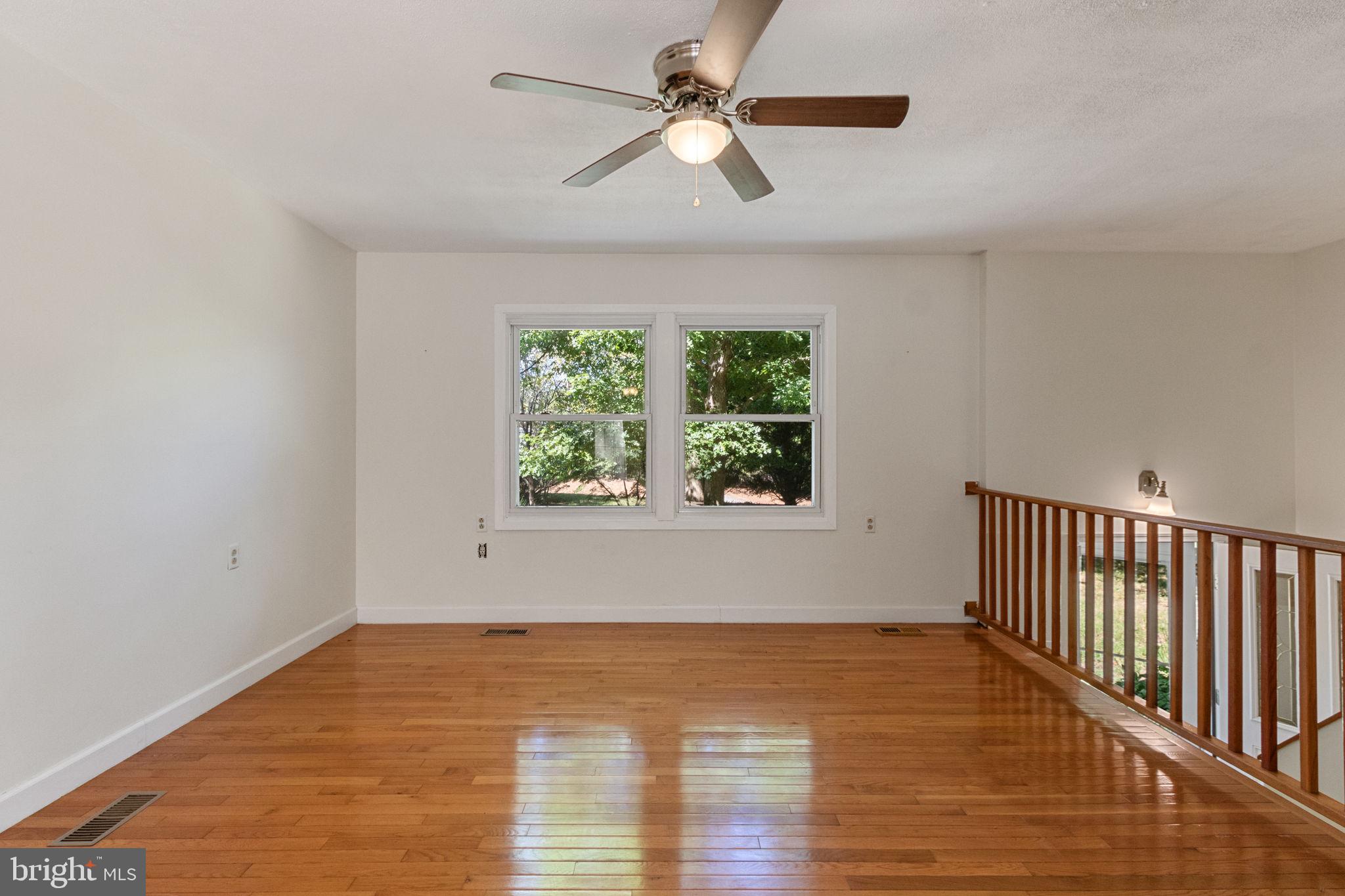 6035 Towles Mill Road Partlow, VA 22534 - Photo 16 of 66 wooden floor in an empty room with a window