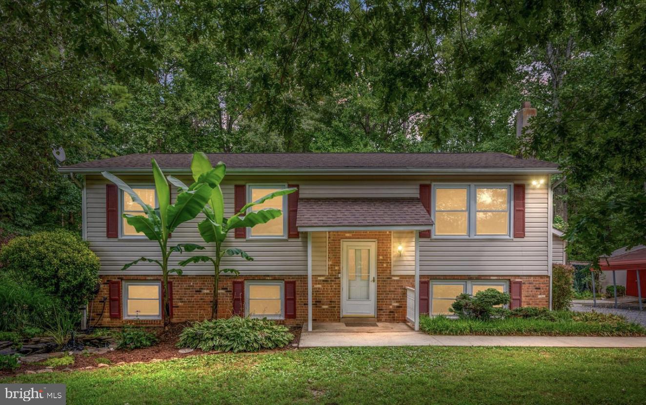 6035 Towles Mill Road Partlow, VA 22534 - Photo 2 of 66 a front view of a house with a yard