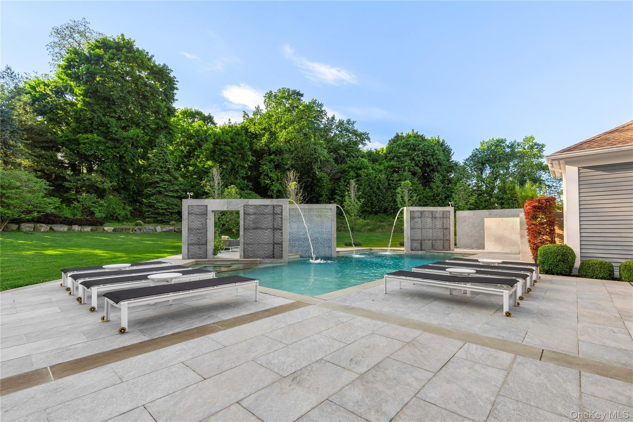 23 Pheasant Drive Rye, NY 10580 - Photo 32 of 35 The pool sculptures are complete with custom lighting and fountains