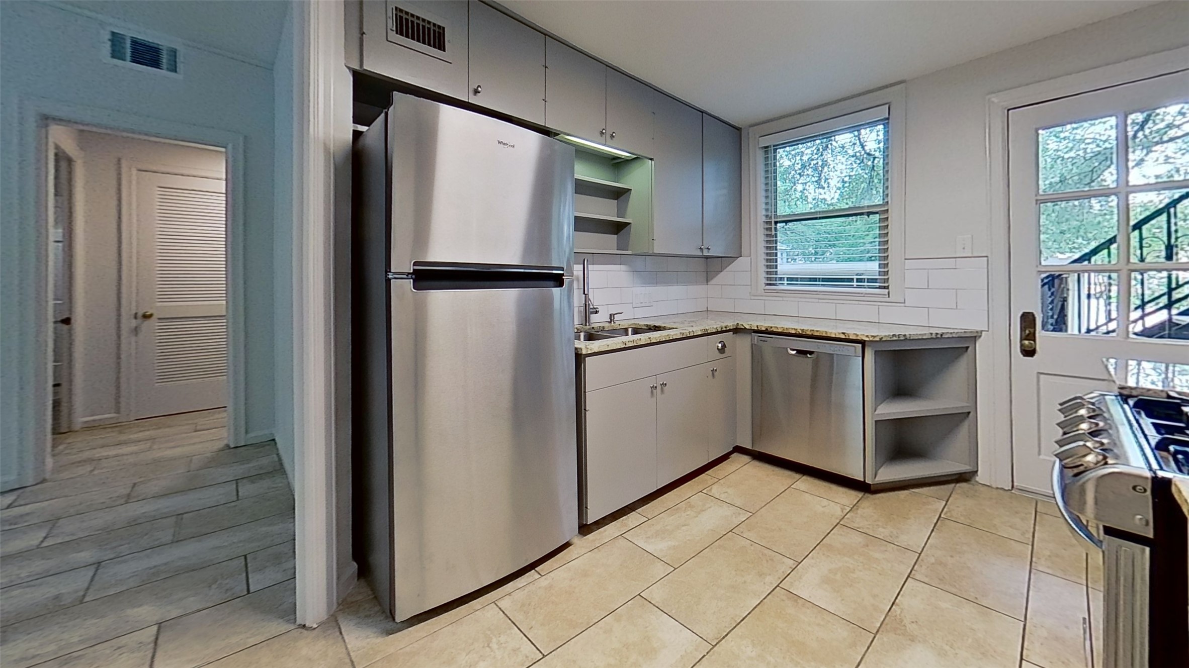 1703 Summit View Place, Unit A Austin, TX 78703 - Photo 5 of 13 A well-appointed kitchen features stainless steel appliances and abundant counter space.