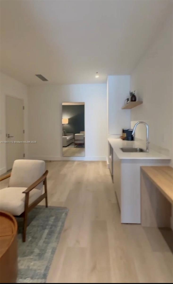 229 Southwest 9th Street, Unit 403 Miami, FL 33130 - Photo 2 of 7 a living room with furniture and a flat screen tv