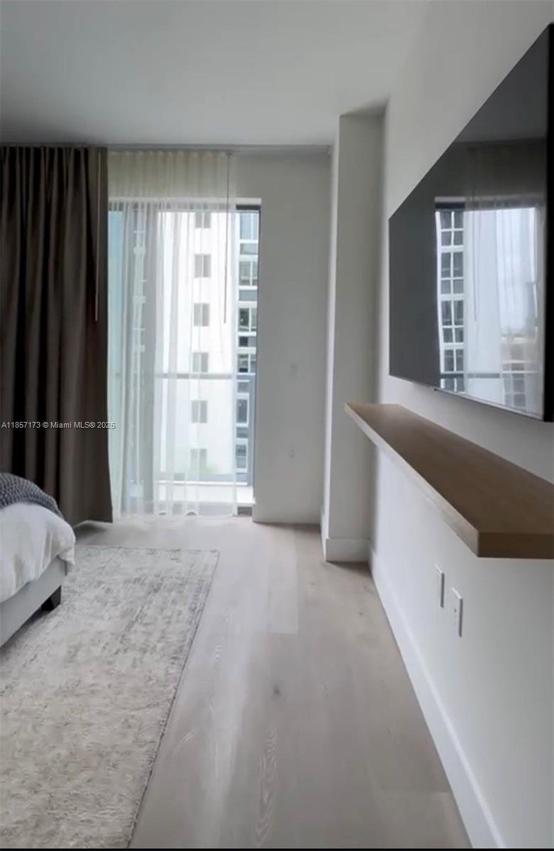 229 Southwest 9th Street, Unit 403 Miami, FL 33130 - Photo 4 of 7 a view of an empty room with a window