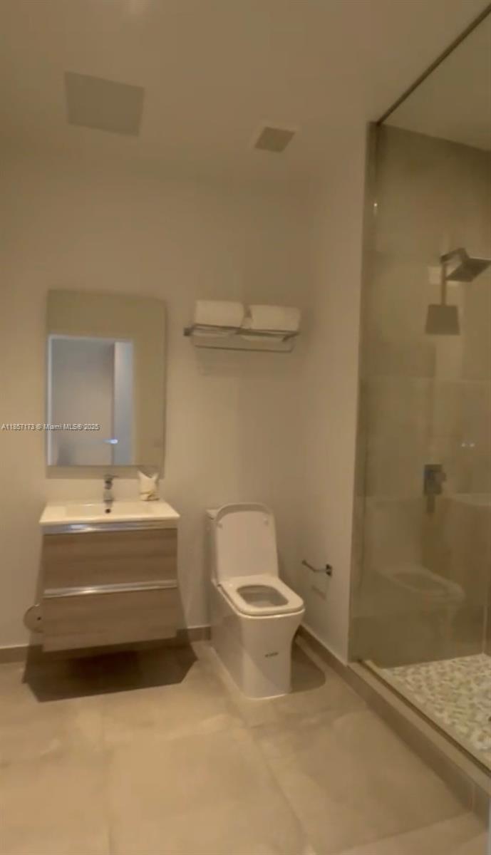 229 Southwest 9th Street, Unit 403 Miami, FL 33130 - Photo 6 of 7 a bathroom with a sink and a mirror