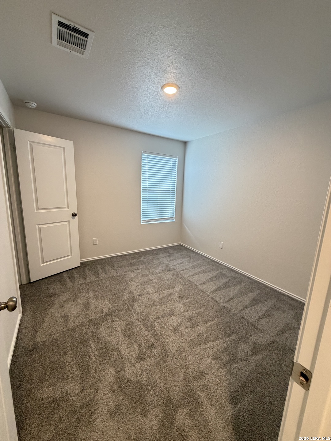 12914 Chinali St. Hedwig, TX 78152 - Photo 16 of 27 an empty room with a natural light