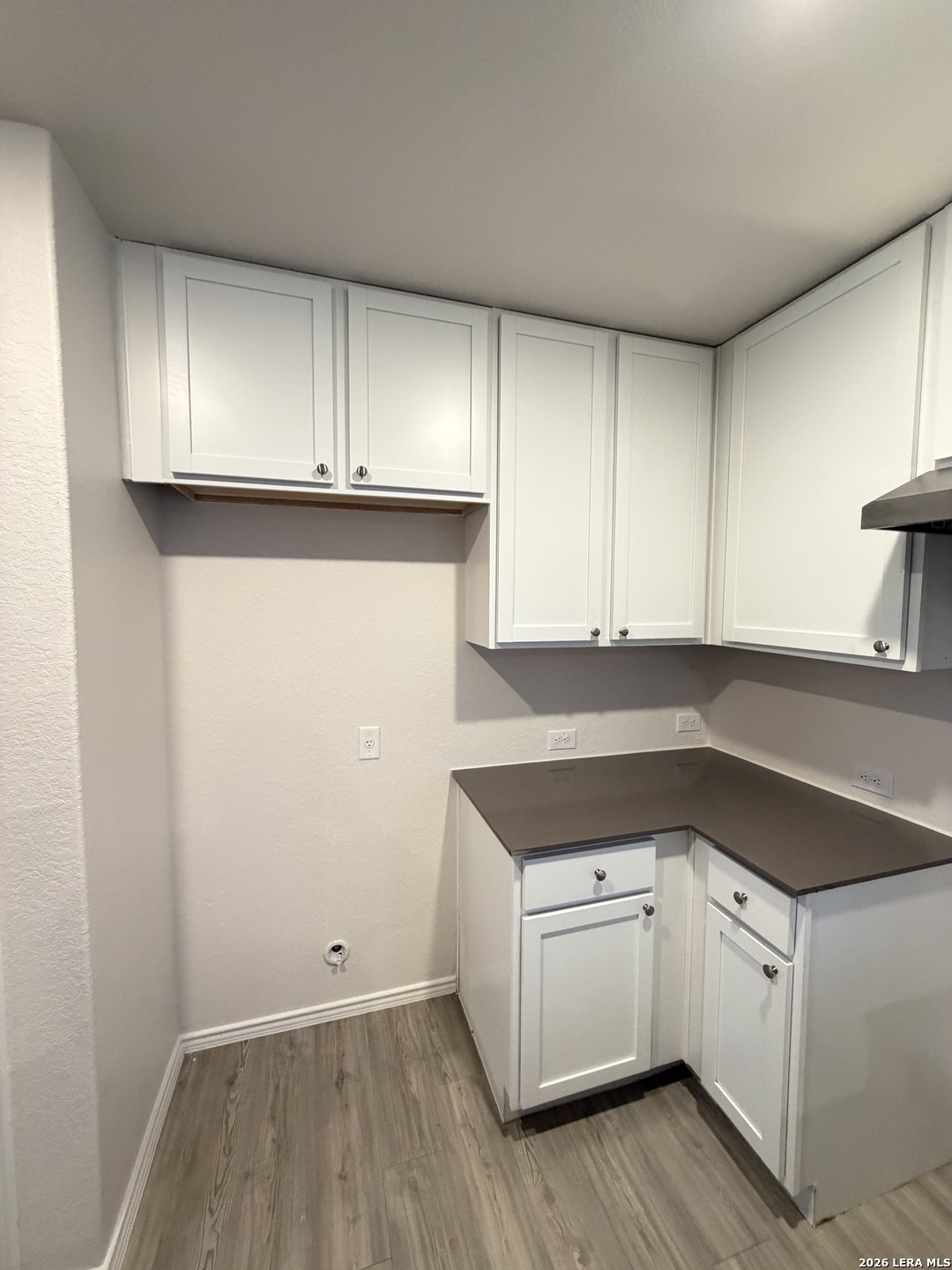12914 Chinali St. Hedwig, TX 78152 - Photo 9 of 27 a kitchen with a sink and cabinets